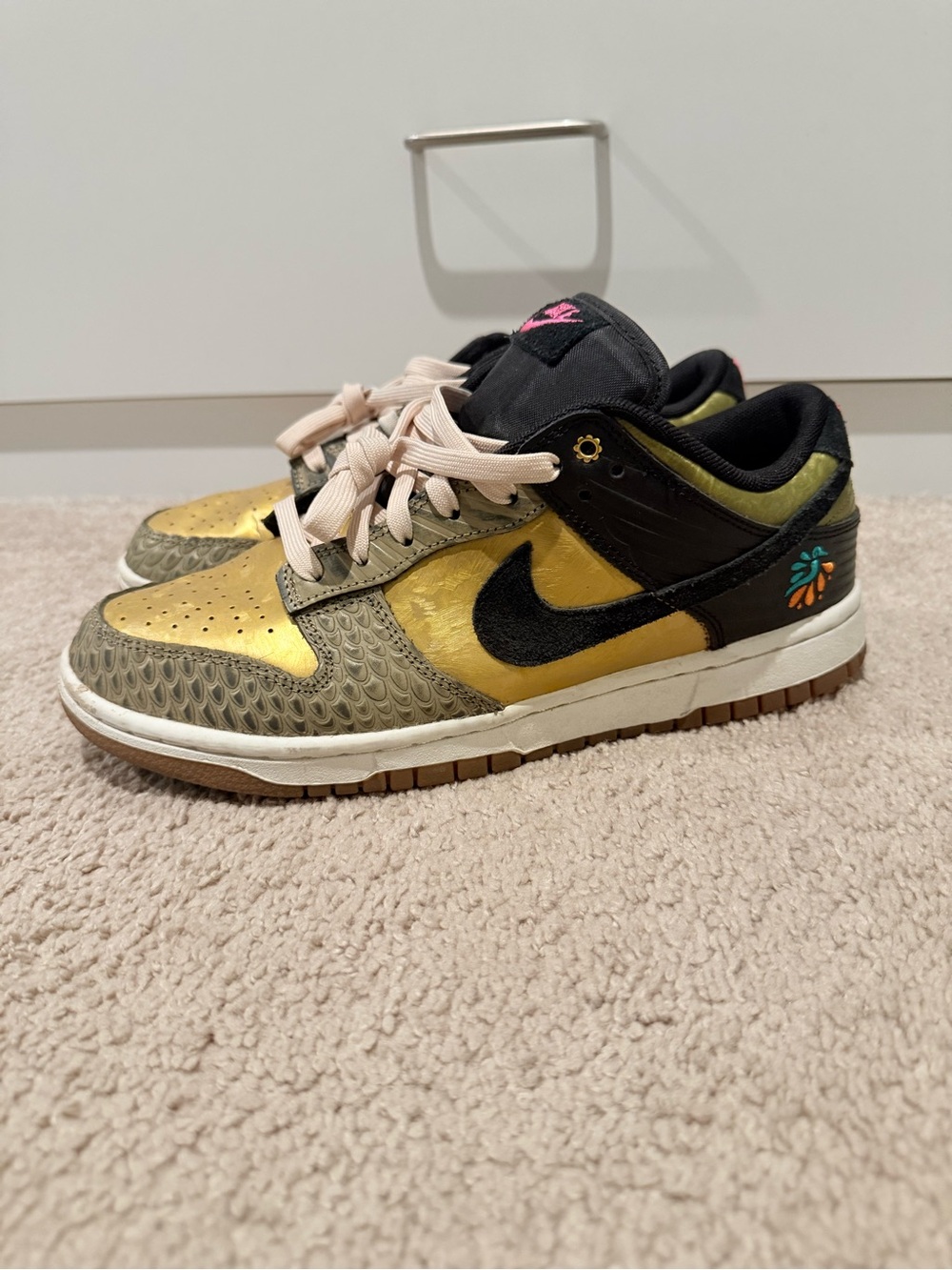Nike women Dunk Lows Sneakers in Gold and Black